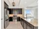 Well-equipped kitchen features granite countertops and modern stainless steel appliances at 10520 Boardwalk Loop # 401, Lakewood Ranch, FL 34202