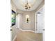 Light and bright hallway with hardwood floors and decorative niche at 6430 Watercrest Way # 201, Lakewood Ranch, FL 34202