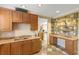 Community kitchen with granite countertops and ample storage at 6430 Watercrest Way # 201, Lakewood Ranch, FL 34202
