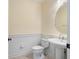 Bathroom includes pedestal sink and an updated toilet at 5654 Simonton St, Bradenton, FL 34203