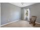 Bedroom with rocking chair, carpet, and ceiling fan at 5654 Simonton St, Bradenton, FL 34203