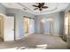 Spacious bedroom with carpet flooring and barn door at 5654 Simonton St, Bradenton, FL 34203