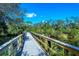 Nature boardwalk path over calm water, surrounded by trees at 5654 Simonton St, Bradenton, FL 34203