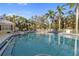 Inviting community pool surrounded by lush tropical landscaping at 5654 Simonton St, Bradenton, FL 34203