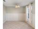 Bright dining room with tile floors and wainscoting at 5654 Simonton St, Bradenton, FL 34203
