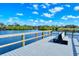 Community dock with seating overlooking a calm waterway at 5654 Simonton St, Bradenton, FL 34203