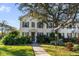 Two-story townhome with shutters, walkway, and landscaping at 5654 Simonton St, Bradenton, FL 34203