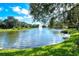 Serene lake with a fountain and lush greenery at 5654 Simonton St, Bradenton, FL 34203