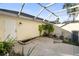 Small patio with pond feature and covered sitting area at 5654 Simonton St, Bradenton, FL 34203