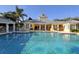 Inviting community pool with a yellow clubhouse at 5654 Simonton St, Bradenton, FL 34203