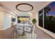 Elegant dining area with round table and modern chairs at 89 Beach Rd # 202 & 203, Sarasota, FL 34242