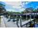 Wooden walkway leads to boat slips on calm water at 5654 Simonton St, Bradenton, FL 34203