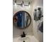 Bathroom featuring a vanity with black hardware, a decorative mirror and a mirror with clock at 4410 Fairways Blvd # 406, Bradenton, FL 34209
