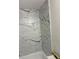 Bathroom showcasing newly tiled shower and tub area with black and white veined tile at 4410 Fairways Blvd # 406, Bradenton, FL 34209