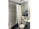 Bathroom featuring a vanity with black hardware, a decorative mirror and a shower/tub at 4410 Fairways Blvd # 406, Bradenton, FL 34209