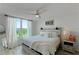 Serene bedroom features a comfortable bed, stylish decor, and a picturesque view from the window at 4410 Fairways Blvd # 406, Bradenton, FL 34209