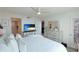 Bright bedroom features a comfortable bed, stylish decor, and ensuite bathroom access at 4410 Fairways Blvd # 406, Bradenton, FL 34209