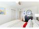 Bedroom featuring a bed with gray headboard, end table, and ceiling fan at 4410 Fairways Blvd # 406, Bradenton, FL 34209