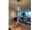 Inviting dining area featuring a large wooden table and a stylish pendant light fixture at 4410 Fairways Blvd # 406, Bradenton, FL 34209