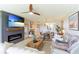 Cozy living room with a fireplace, stylish furnishings, and an open concept to the kitchen at 4410 Fairways Blvd # 406, Bradenton, FL 34209