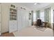 Bedroom with a Murphy bed, built-in shelving, and a home office at 6031 Grandview Hill Ct, Bradenton, FL 34203