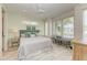 Main bedroom with king bed, light walls, and wood floors at 2314 Avenue B, Bradenton Beach, FL 34217