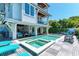 Large pool and spa with spacious deck and lounge chairs, adjacent to home at 2314 Avenue B, Bradenton Beach, FL 34217