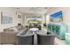 Bright and airy living room with comfortable seating and a large TV at 2314 Avenue B, Bradenton Beach, FL 34217