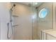 Large walk-in shower with glass enclosure and modern tile at 2314 Avenue B, Bradenton Beach, FL 34217