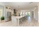 Modern kitchen featuring white cabinetry, quartz countertops, and stainless steel appliances at 2314 Avenue B, Bradenton Beach, FL 34217