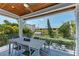 Outdoor deck with table and chairs, offering backyard views at 2314 Avenue B, Bradenton Beach, FL 34217
