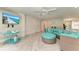 Spacious living room with comfortable seating, large TV and access to patio at 2314 Avenue B, Bradenton Beach, FL 34217