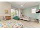 Bright bedroom with two twin beds, coastal decor, and wood floors at 2314 Avenue B, Bradenton Beach, FL 34217