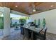 Covered patio features outdoor dining table with seating for six, plus a grill at 2314 Avenue B, Bradenton Beach, FL 34217