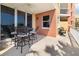 Wide balcony area with seating and a view of the nearby buildings and lush greenery at 611 Riviera Dunes Way # 108, Palmetto, FL 34221