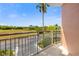 Private balcony area with calming views of nearby trees and street at 611 Riviera Dunes Way # 108, Palmetto, FL 34221