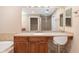 This bathroom features ample vanity space and a make-up area with great mirror lighting at 611 Riviera Dunes Way # 108, Palmetto, FL 34221