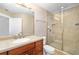 Updated bathroom featuring a glass shower and plenty of vanity space at 611 Riviera Dunes Way # 108, Palmetto, FL 34221