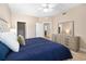 Bedroom with ample dresser storage and access to other rooms at 611 Riviera Dunes Way # 108, Palmetto, FL 34221
