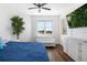 Bedroom featuring a window with a water view, a seating area, and a mounted TV at 611 Riviera Dunes Way # 108, Palmetto, FL 34221