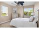 Inviting bedroom features plush carpet, two large windows, and neutral decor to create a calming space at 611 Riviera Dunes Way # 108, Palmetto, FL 34221
