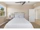 Bright bedroom featuring neutral walls, carpet flooring and a large window for lots of natural light at 611 Riviera Dunes Way # 108, Palmetto, FL 34221