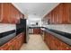 Well-equipped kitchen with stainless steel appliances, dark countertops, and ample cabinetry at 611 Riviera Dunes Way # 108, Palmetto, FL 34221