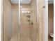 Tiled shower with glass doors at 611 Riviera Dunes Way # 108, Palmetto, FL 34221
