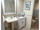 Bathroom with pedestal sink and white cabinet at 6503 Stone River Rd # 109, Bradenton, FL 34203