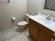 Guest bathroom with toilet, vanity, and tiled floor at 6503 Stone River Rd # 109, Bradenton, FL 34203