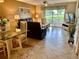 Spacious living room featuring comfortable seating and sliding doors to a patio at 6503 Stone River Rd # 109, Bradenton, FL 34203