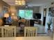 Combined living and dining area with TV and patio view at 6503 Stone River Rd # 109, Bradenton, FL 34203