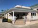 Relaxing community patio with seating area and golf cart at 6503 Stone River Rd # 109, Bradenton, FL 34203