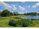 Scenic golf course view with pond and lush landscaping at 6503 Stone River Rd # 109, Bradenton, FL 34203